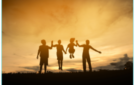 Family playing at sunset